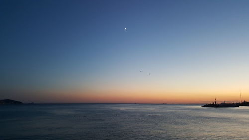 Scenic view of sea at sunset