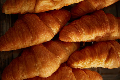 Baked croissants close up texture. many croissants pattern concept.