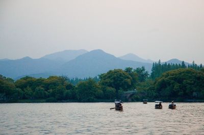 Scenic view of boats in lake