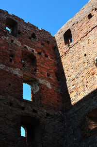 Low angle view of historic building against clear sky