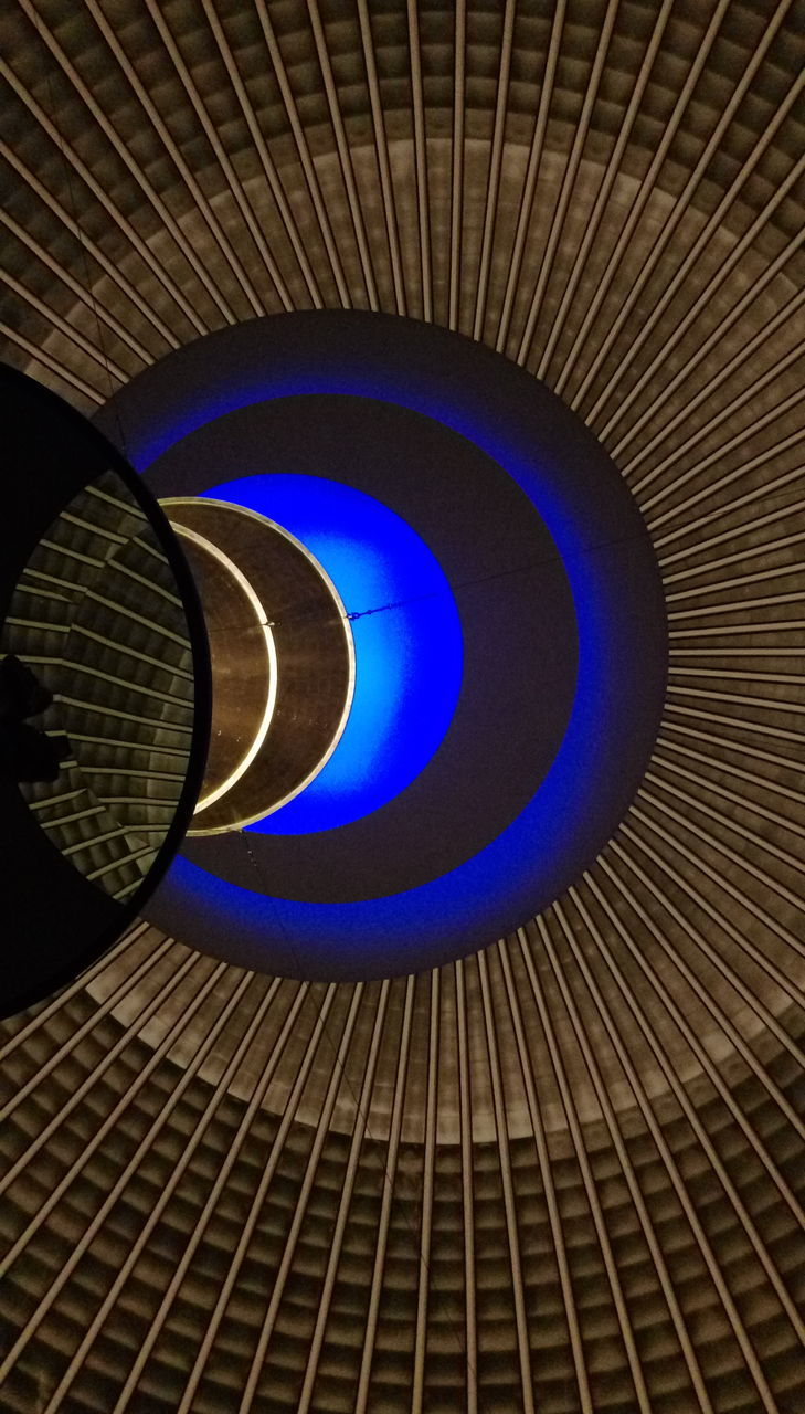 indoors, pattern, no people, blue, close-up, circle, shape, geometric shape, technology, illuminated, design, ceiling, architecture, metal, low angle view, wall - building feature, built structure, communication, full frame, night