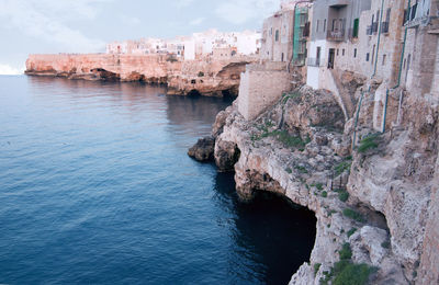 Panoramic view of sea against buildings