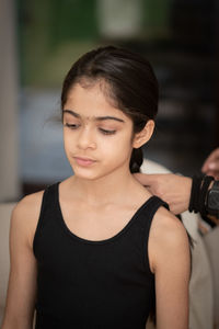 Portrait of young woman exercising in gym