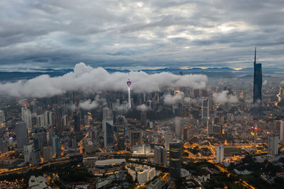 Aerial view of cityscape against sky