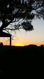 Silhouette tree against sky during sunset