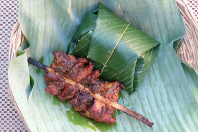 High angle view of leaves on barbecue grill