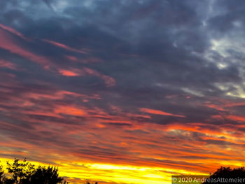 Scenic view of dramatic sky during sunset