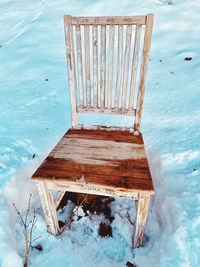 Wooden structure on snow covered land