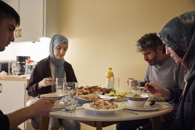 Family eating dinner together at home