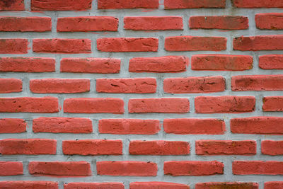 Full frame shot of red brick wall
