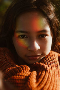 Woman portrait wearing orange sweater