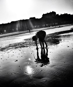 Reflection of woman in water