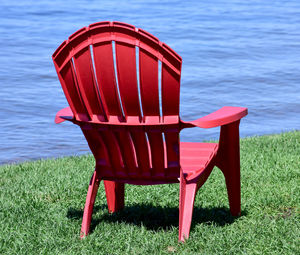 Summer red chairs in minnesota along the lake