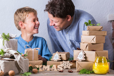 Cheerful boy with father at home