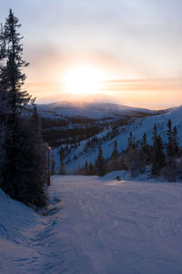 Scenic view of landscape against sky during sunset