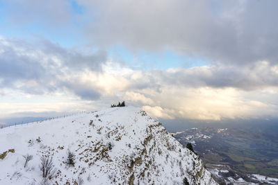 Scenic view of snow covered mountain against sky