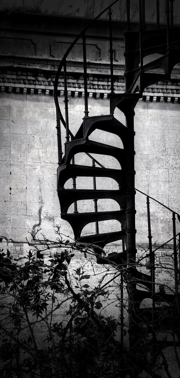 built structure, architecture, transportation, metal, bicycle, railing, indoors, wall - building feature, abandoned, no people, mode of transport, connection, day, steps, building exterior, wheel, sunlight, absence, shadow