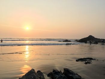 Scenic view of sea against sky at sunset