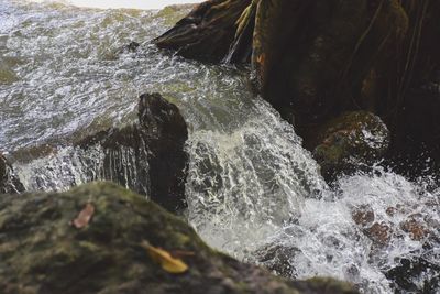 Close-up of water splashing on rocks