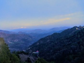 Scenic view of mountains against sky during sunset