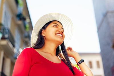 Smiling young woman wearing hat