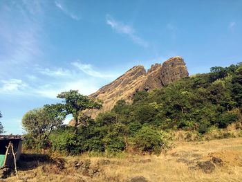 Rock formations on landscape against sky