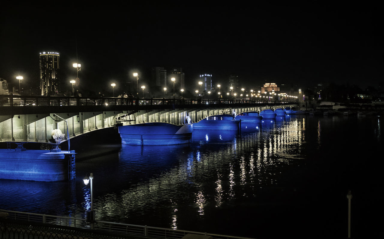 Egyptian bridge with blue lights at night