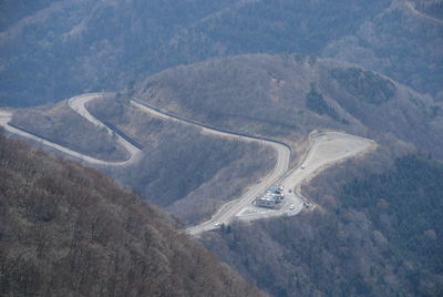 High angle view of road amidst mountains