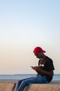 Rear view of man standing at beach