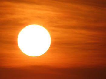 Low angle view of sun against sky during sunset