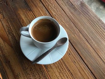 High angle view of coffee cup on table