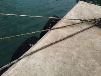 High angle view of rope tied on boat