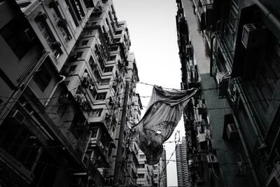 Low angle view of buildings in city against sky