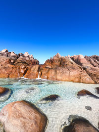 Natural spa below blue sky