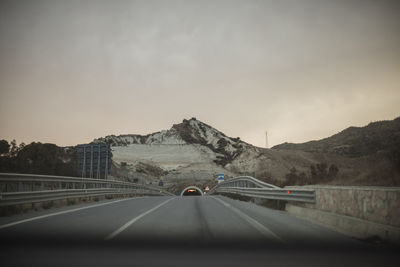 Empty road against sky