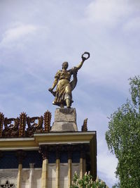 Low angle view of statue against sky