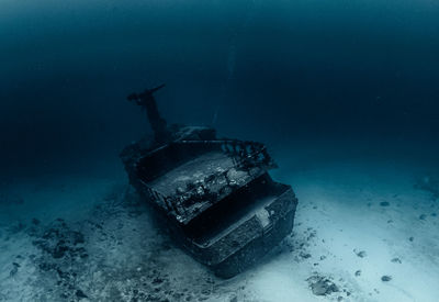 Abandoned boat in sea