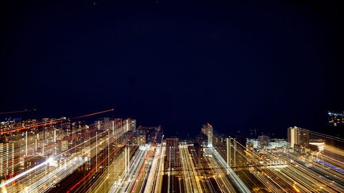 Aerial view of illuminated city at night