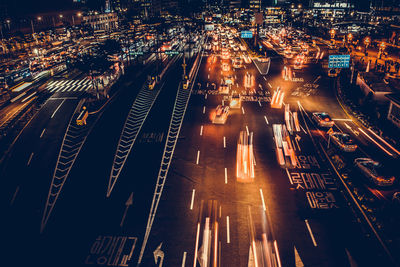 High angle view of light trails on city street at night