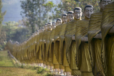 Sculpture of statues in row