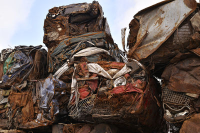 Low angle view of garbage against sky