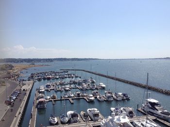 High angle view of boats moored at harbor