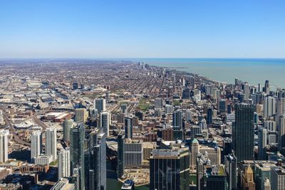 High angle view of buildings in city against clear sky