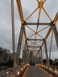 Bridge against sky in city