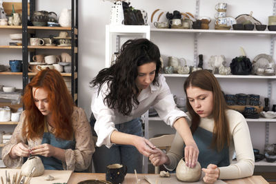 Pottery workshop class. a pottery crafts dish from a raw clay. creating ceramics