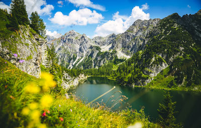 Scenic view of lake and mountains against sky