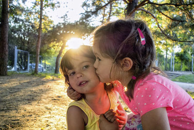 Close-up of mother and daughter eating tree