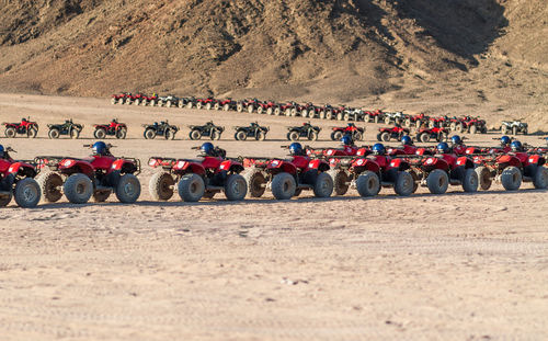 Quadbikes parked at desert