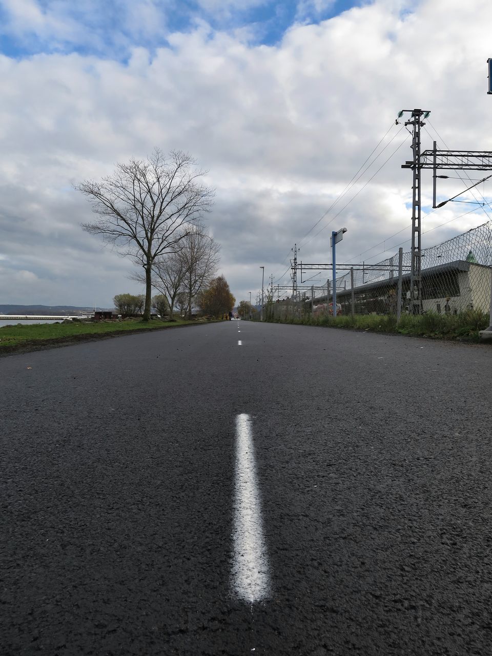 the way forward, sky, road, transportation, diminishing perspective, road marking, vanishing point, cloud - sky, asphalt, tree, empty, street, empty road, cloudy, country road, cloud, street light, long, surface level, tranquility