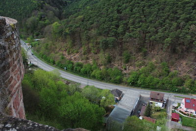 High angle view of road amidst trees and mountains